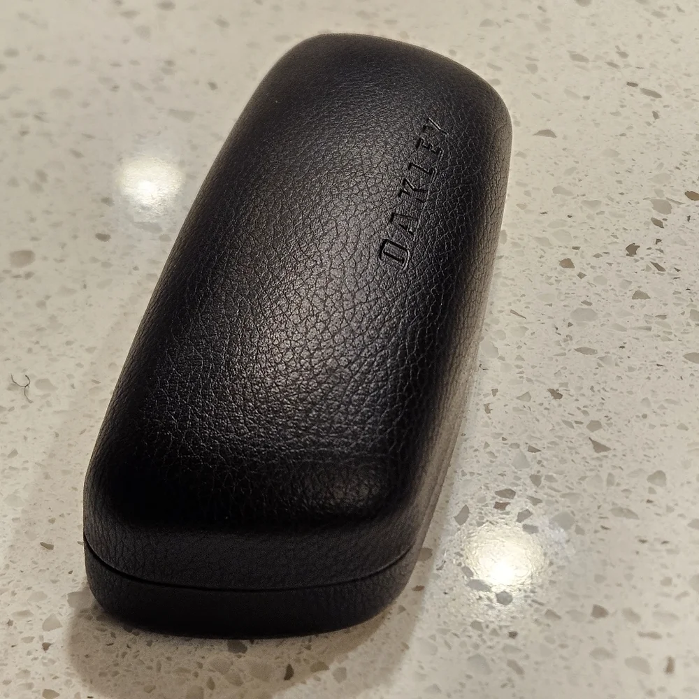 Oakley Black Hard Clam Shell Dimple Glasses Case | Black Embossed Logo